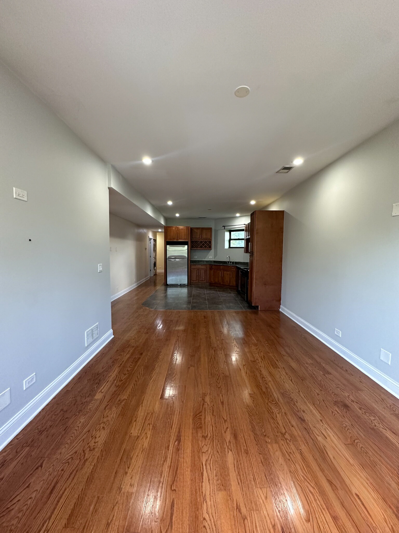 4336 South Indiana Avenue, Unit 1 Chicago, IL 60653 - Photo 6 of 15 a view of a room with wooden floor