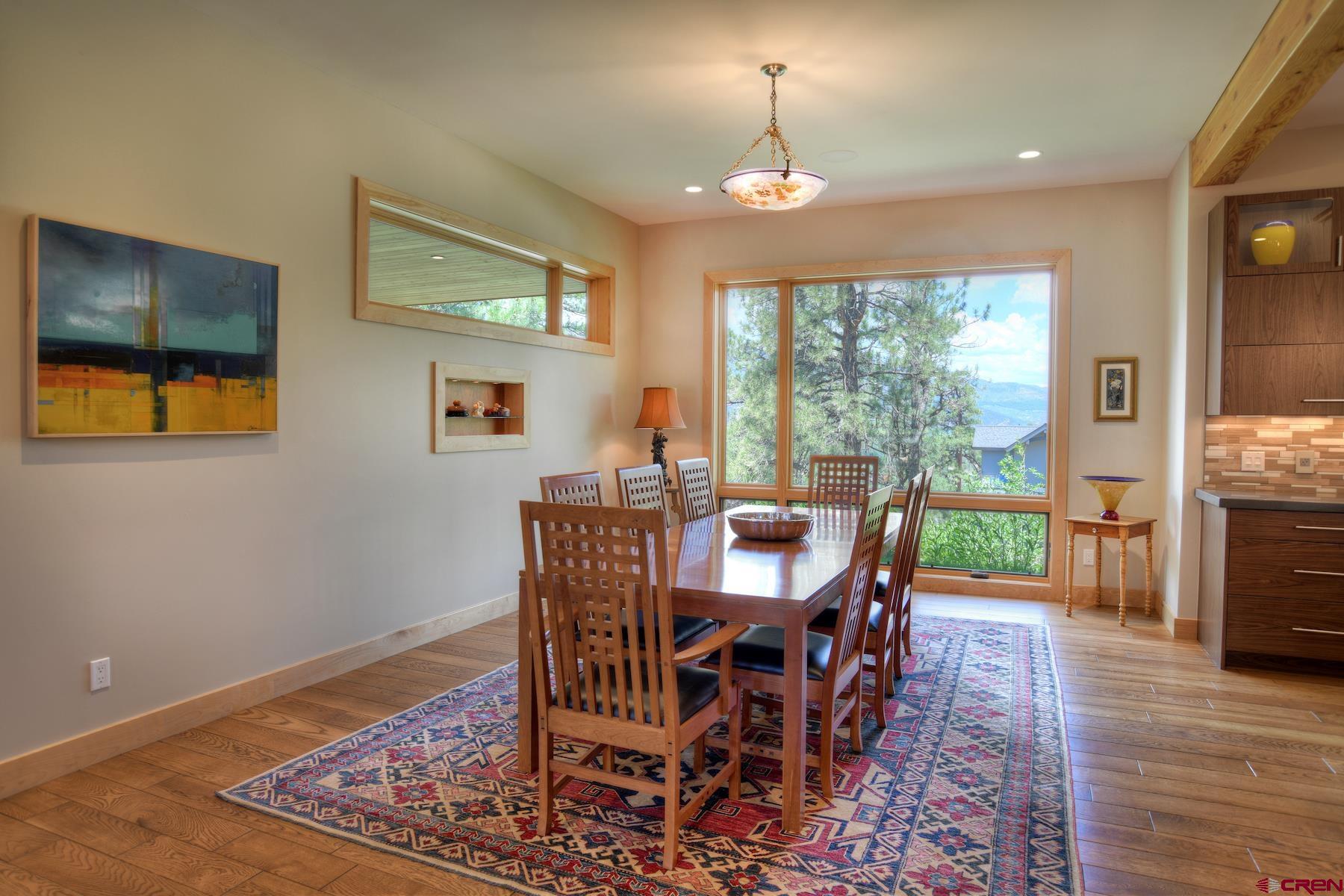 15 Eagle Ridge Road Durango, CO 81301 - Photo 12 of 35 a view of a dining room with furniture window and wooden floor