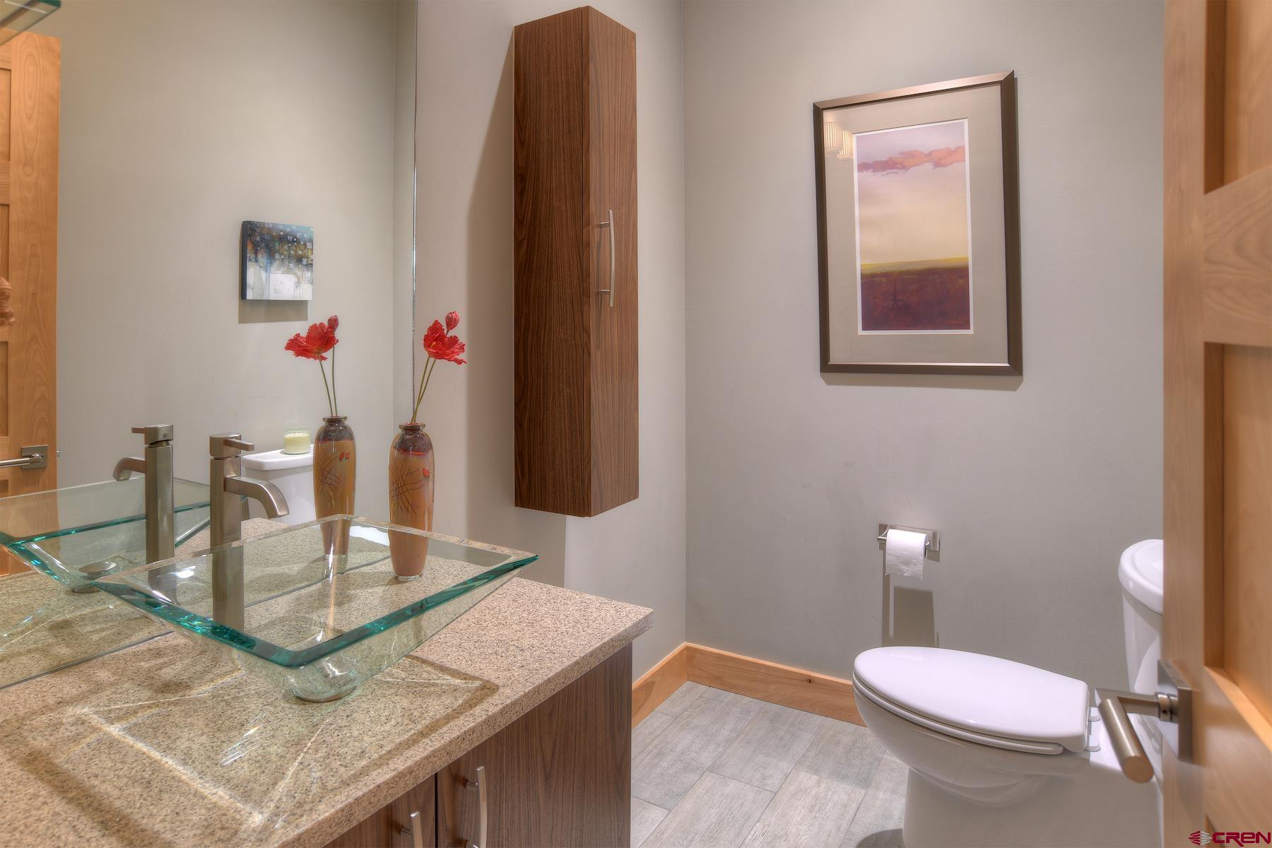 15 Eagle Ridge Road Durango, CO 81301 - Photo 13 of 35 a bathroom with a sink a toilet and mirror