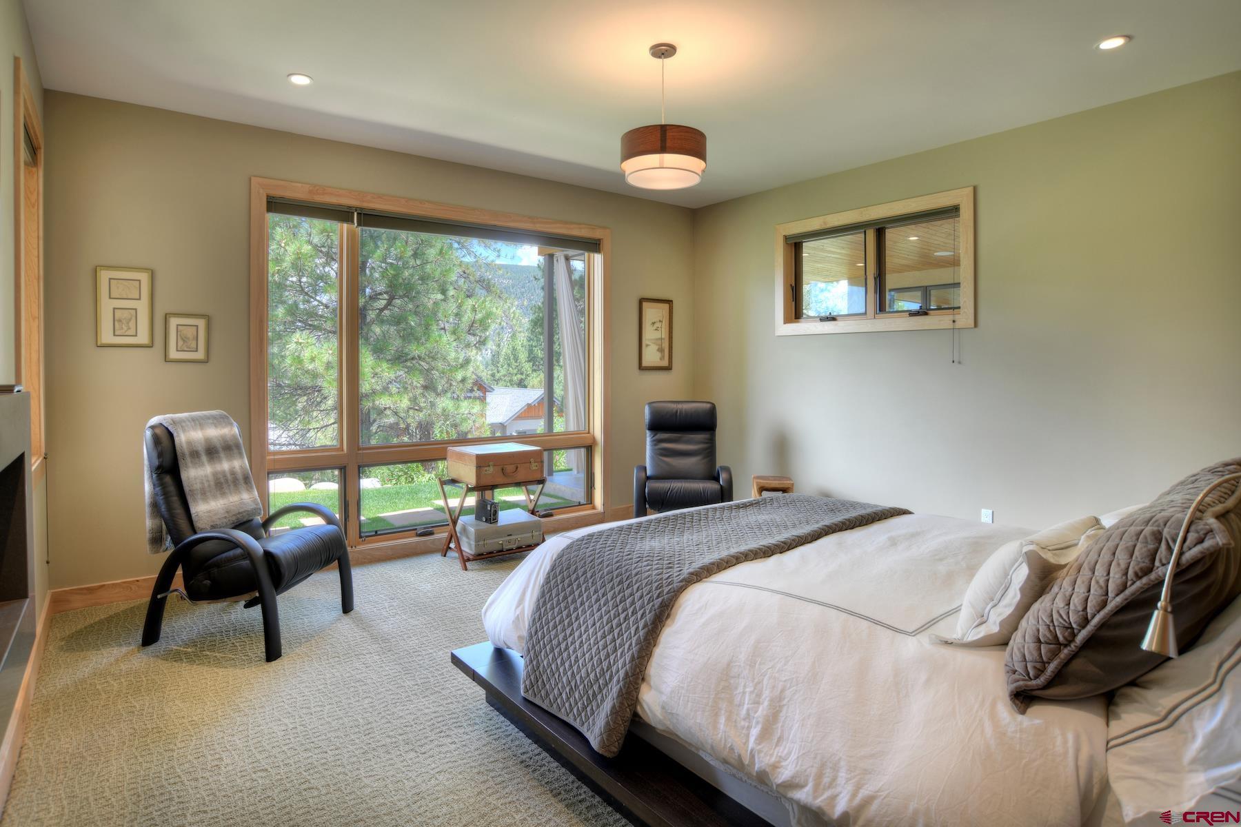 15 Eagle Ridge Road Durango, CO 81301 - Photo 15 of 35 a bedroom with a bed and a large window