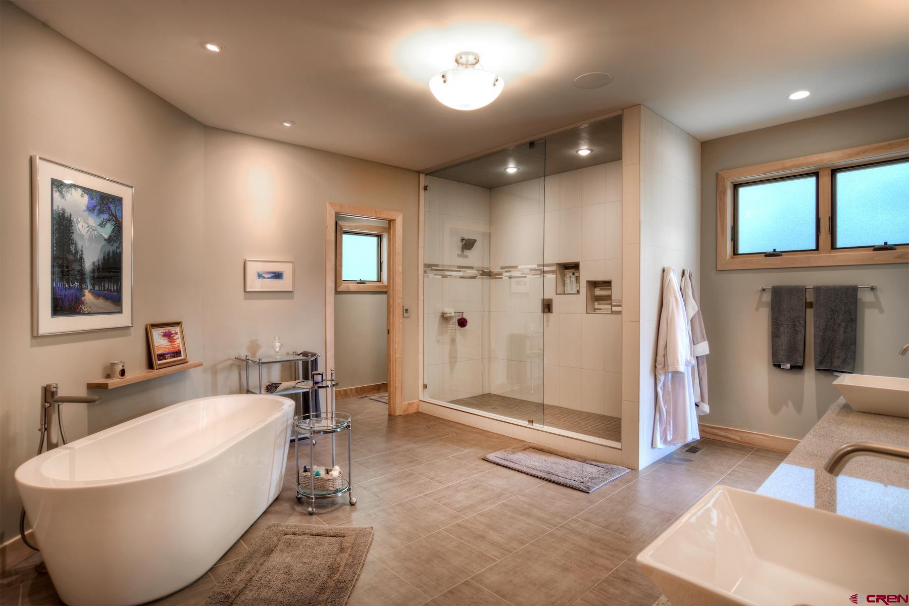 15 Eagle Ridge Road Durango, CO 81301 - Photo 16 of 35 a bathroom with a bathtub and a shower