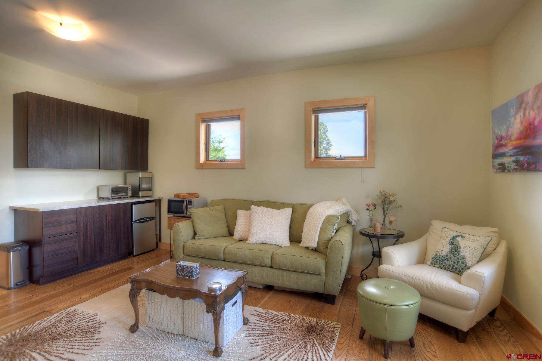 15 Eagle Ridge Road Durango, CO 81301 - Photo 21 of 35 a living room with furniture and a wooden floor