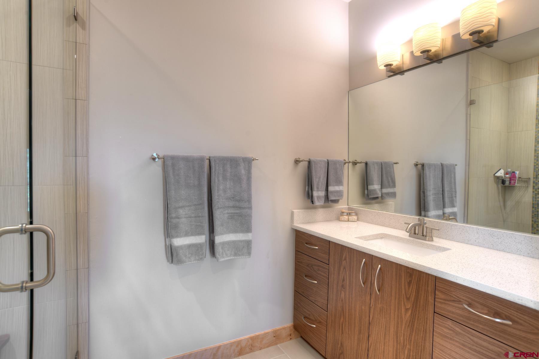 15 Eagle Ridge Road Durango, CO 81301 - Photo 23 of 35 a bathroom with a sink and a mirror