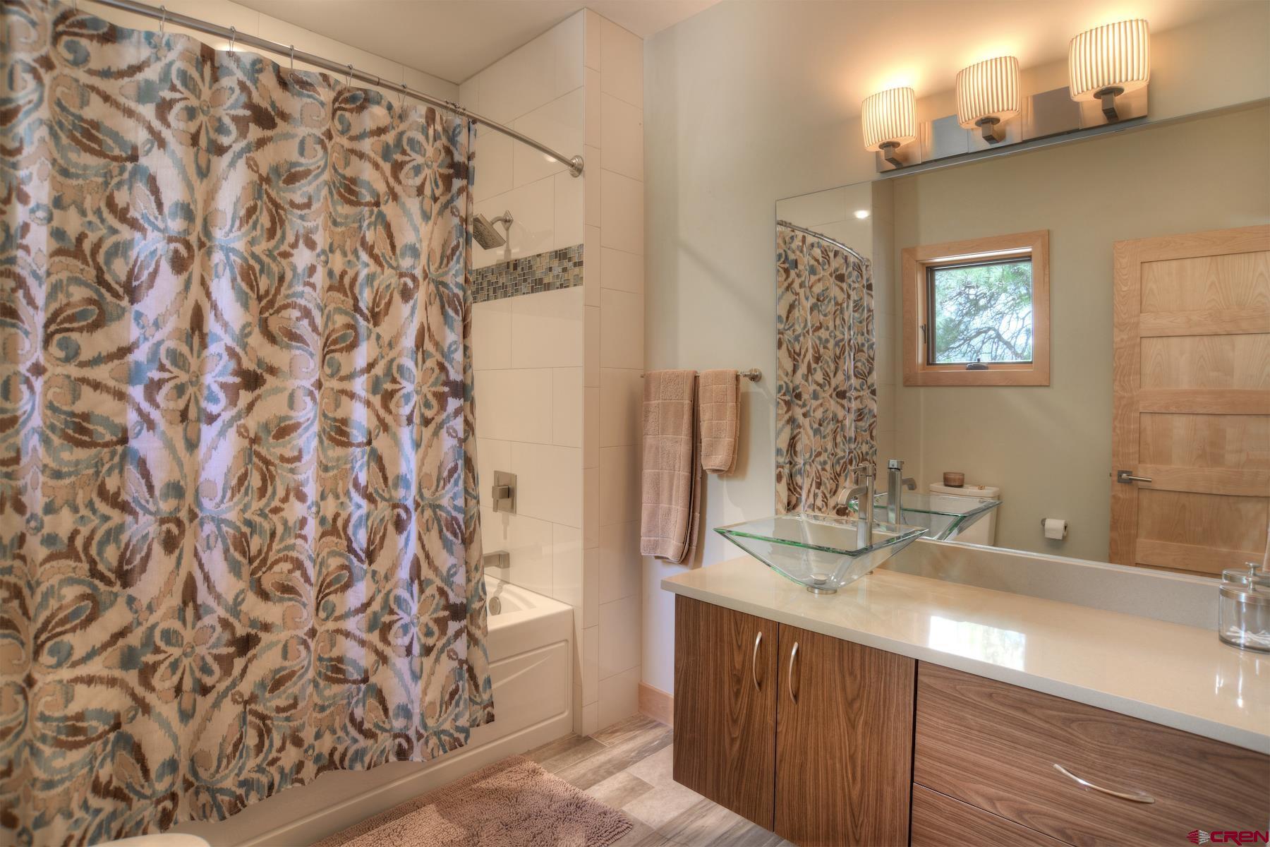 15 Eagle Ridge Road Durango, CO 81301 - Photo 25 of 35 a bathroom with a sink and a mirror