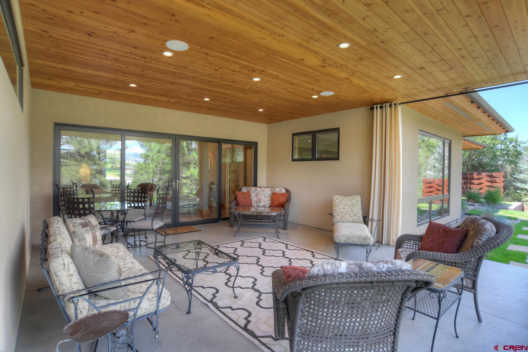 15 Eagle Ridge Road Durango, CO 81301 - Photo 29 of 35 a living room with furniture and a floor to ceiling window