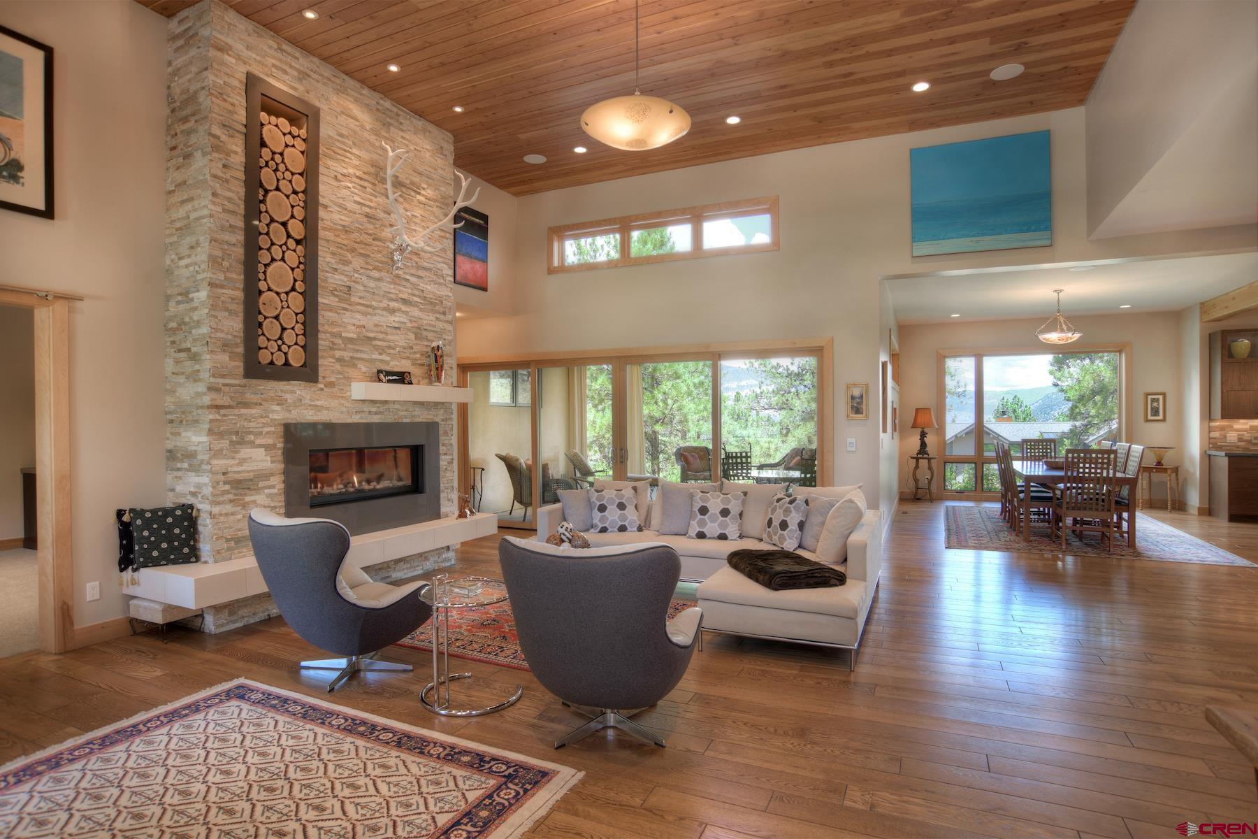 15 Eagle Ridge Road Durango, CO 81301 - Photo 5 of 35 a living room with furniture and a fireplace
