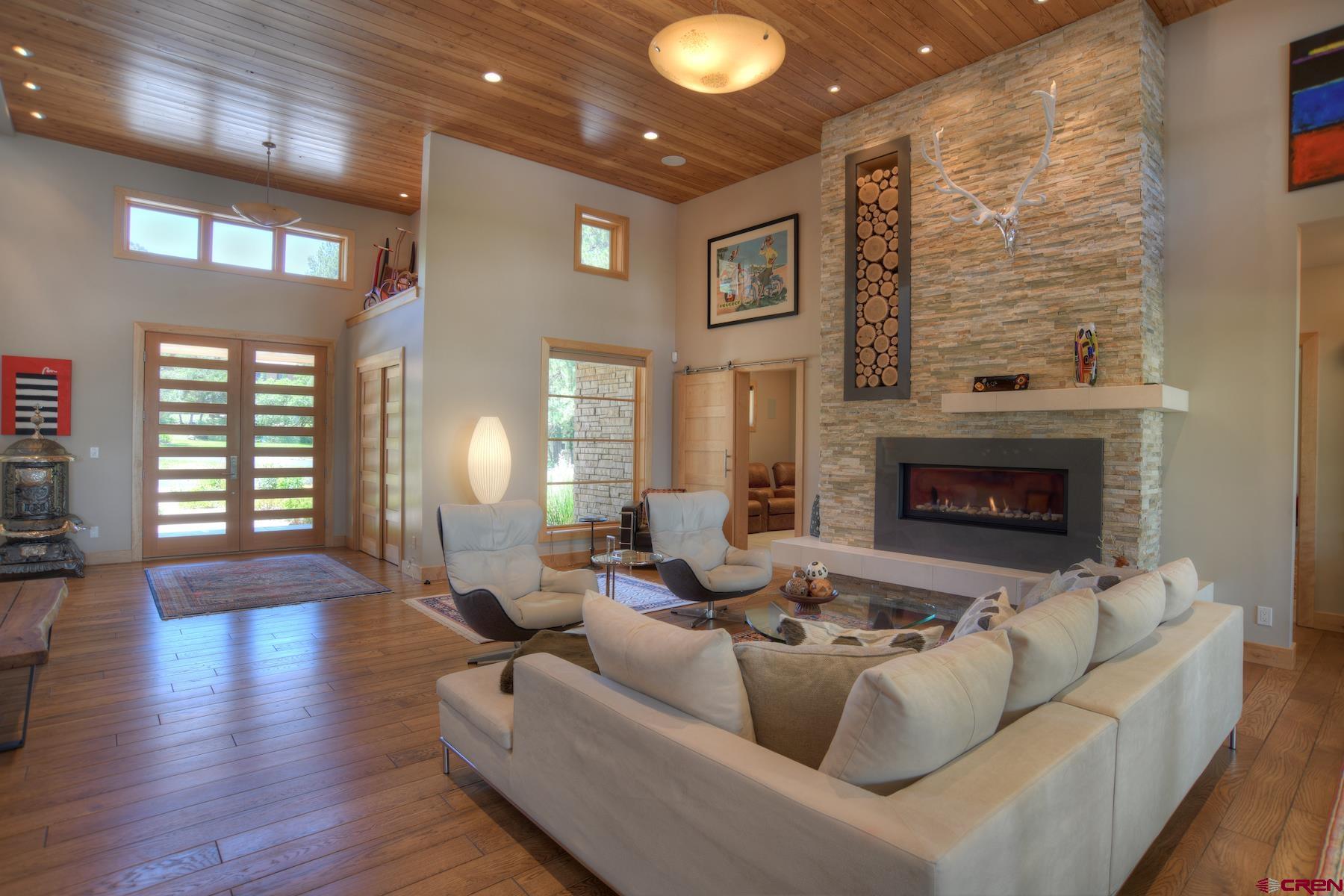 15 Eagle Ridge Road Durango, CO 81301 - Photo 6 of 35 a living room with furniture and a fireplace