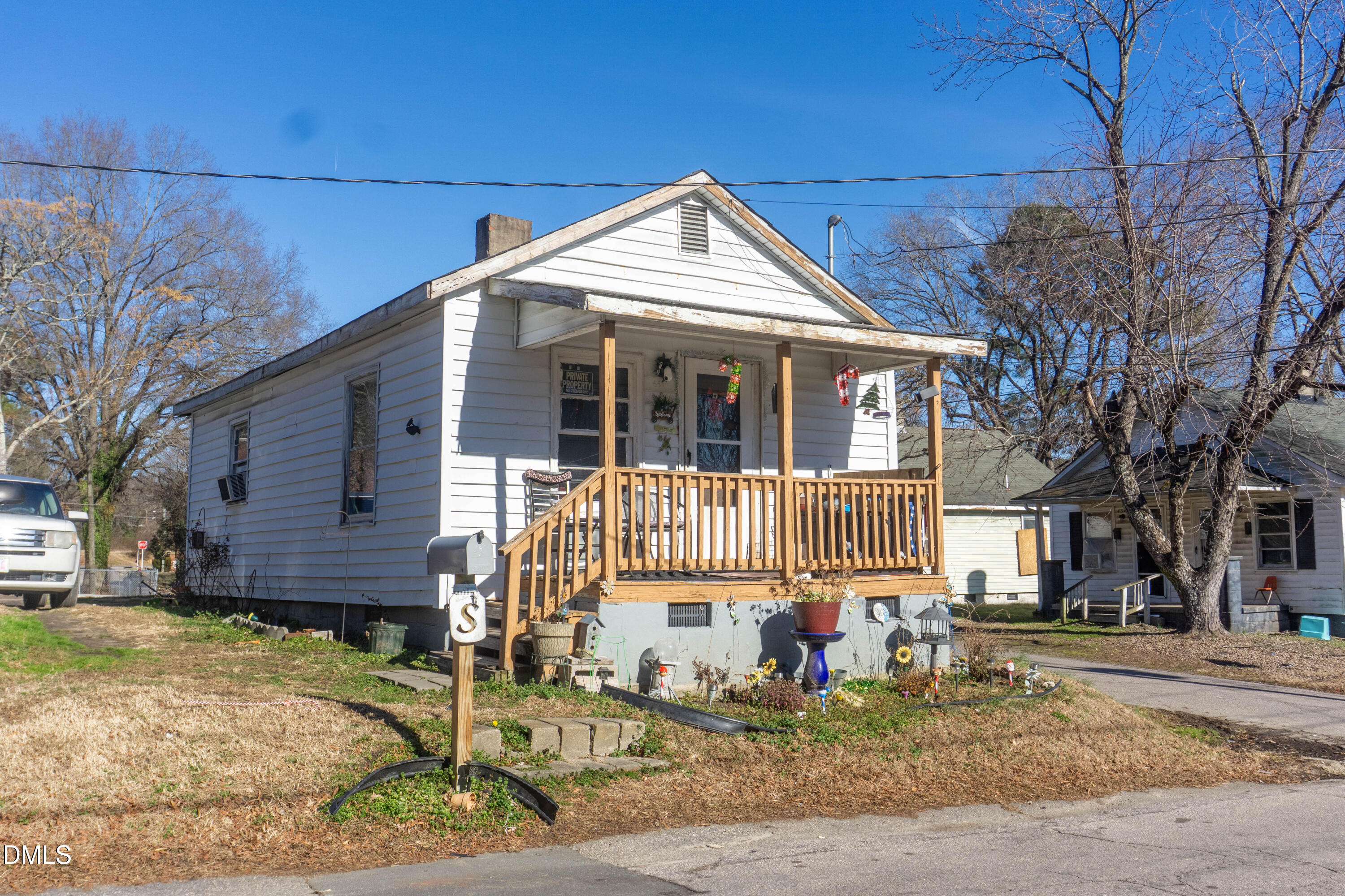 647 Marshall Street Henderson, NC 27536 - Photo 12 of 15 a front view of a house with a yard