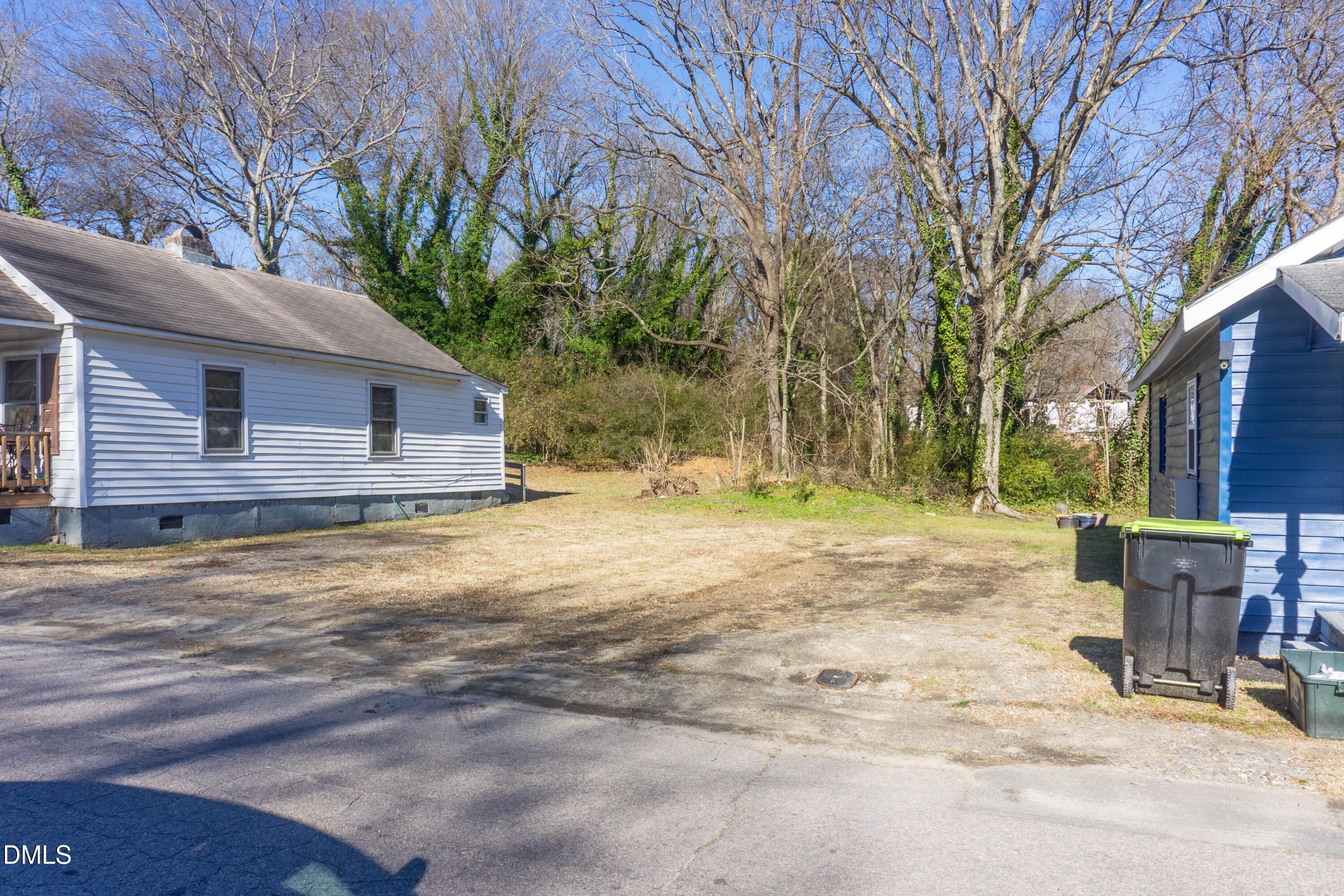 647 Marshall Street Henderson, NC 27536 - Photo 15 of 15 a backyard of a house with table and chairs