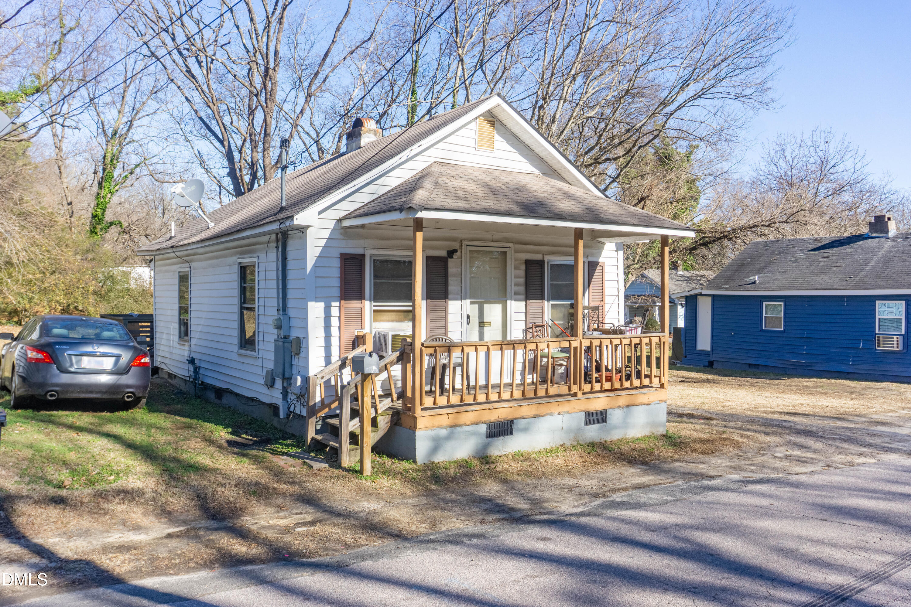 647 Marshall Street Henderson, NC 27536 - Photo 2 of 15 a view of a house with a yard and wooden fence