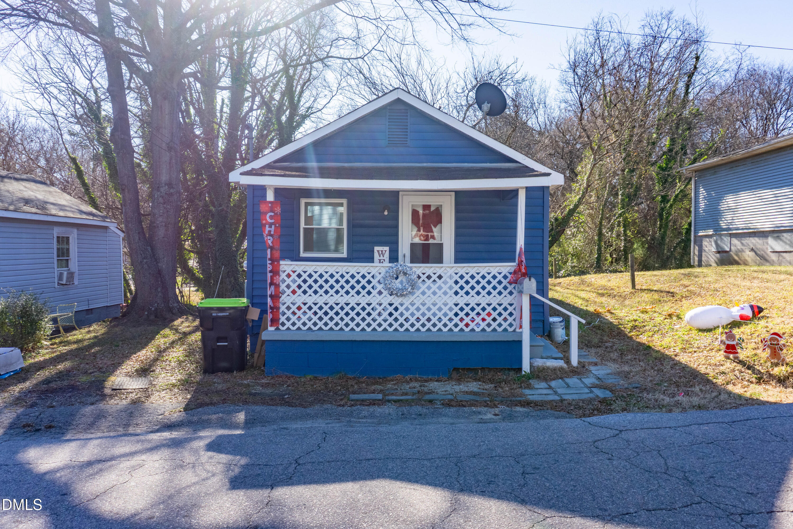 647 Marshall Street Henderson, NC 27536 - Photo 6 of 15 a front view of a house with a yard