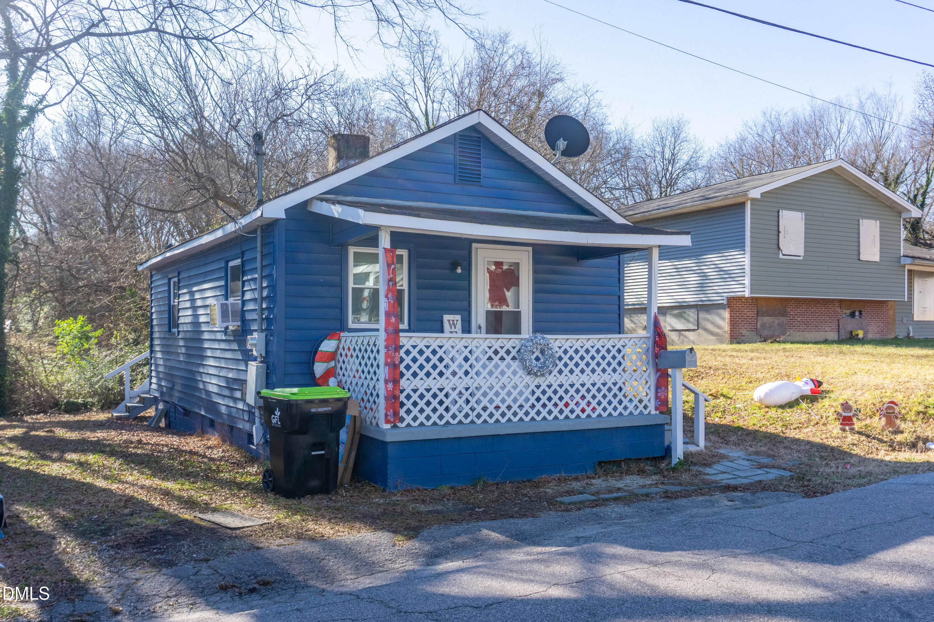 647 Marshall Street Henderson, NC 27536 - Photo 7 of 15 a view of a house with a yard patio and a yard