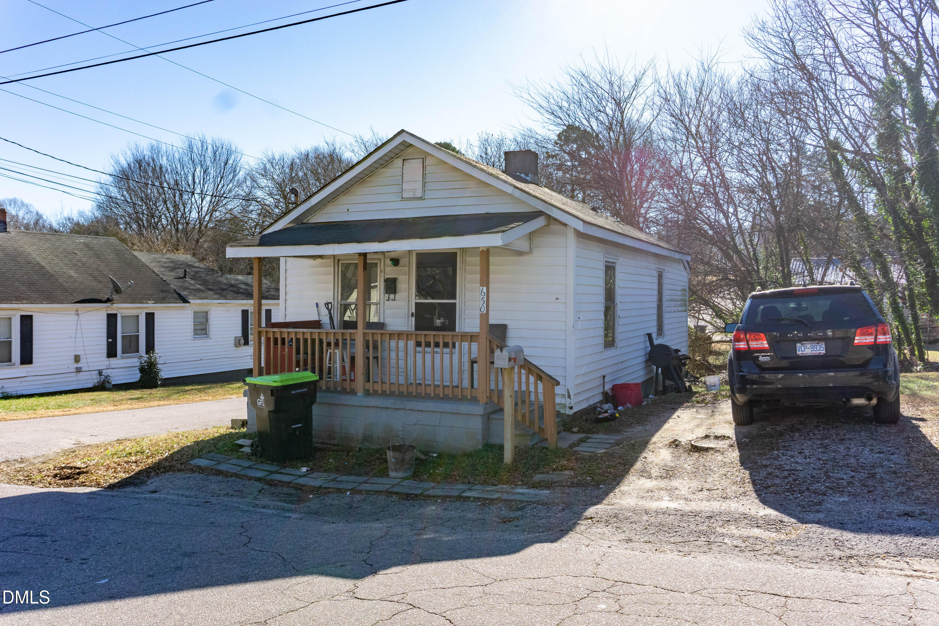 647 Marshall Street Henderson, NC 27536 - Photo 10 of 15 a front view of a house with garden