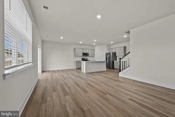 a view of kitchen with wooden floor