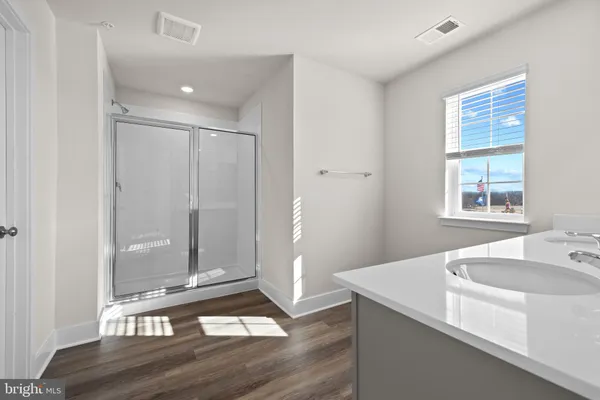 a view of a bathroom with sink and bathtub