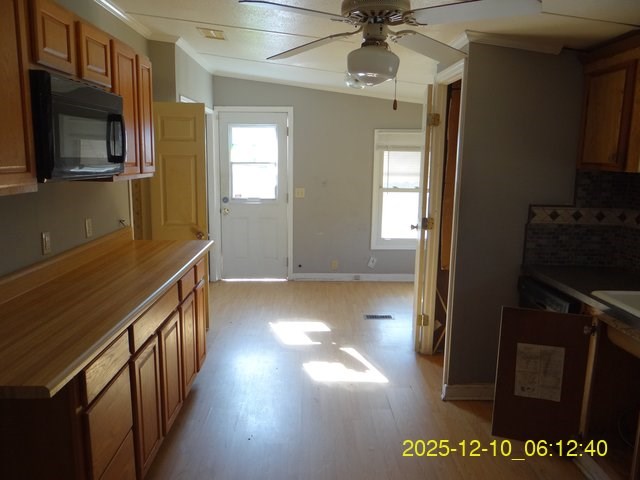 641 Cusseta Highway Box Springs, GA 31801 - Photo 11 of 18 a view of hallway with stairs and wooden floor