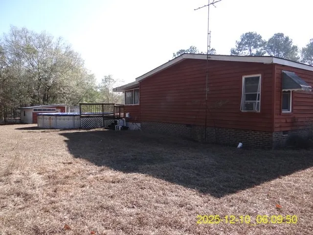a backyard of a house with yard fire pit and garage