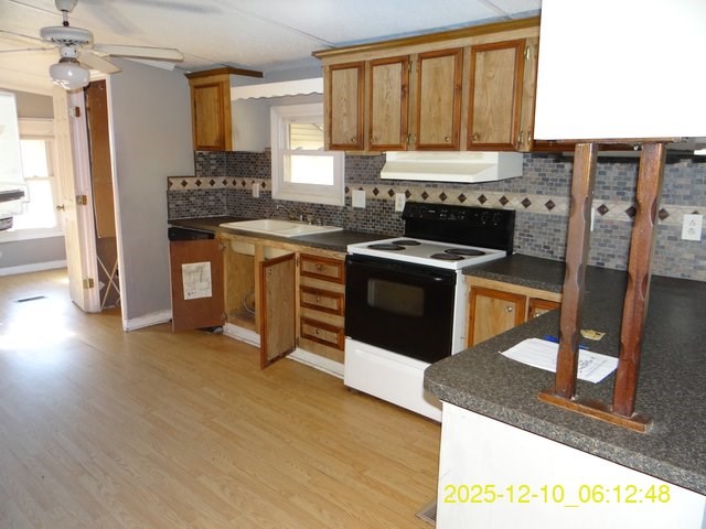 641 Cusseta Highway Box Springs, GA 31801 - Photo 9 of 18 a kitchen with a stove a sink and a refrigerator