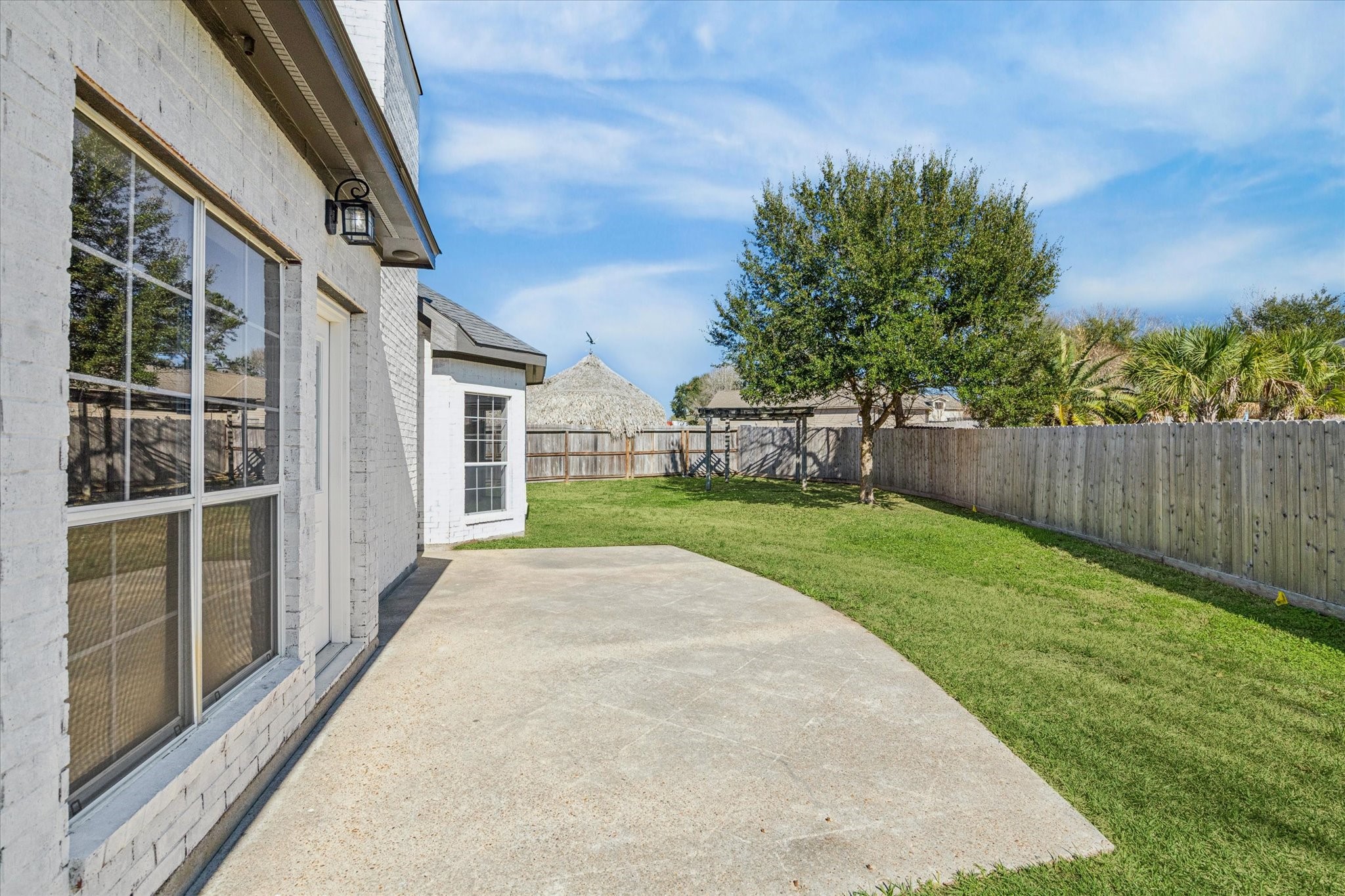 5437 Edgewater Court Willis, TX 77318 - Photo 28 of 29 a view of an house with backyard and garden