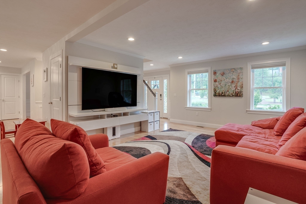 83 Littleton Road Ayer, MA 01432 - Photo 11 of 42 a living room with furniture and a flat screen tv
