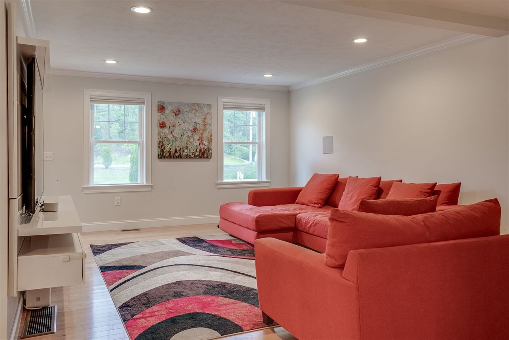 83 Littleton Road Ayer, MA 01432 - Photo 12 of 42 a bedroom with a bed and a couch