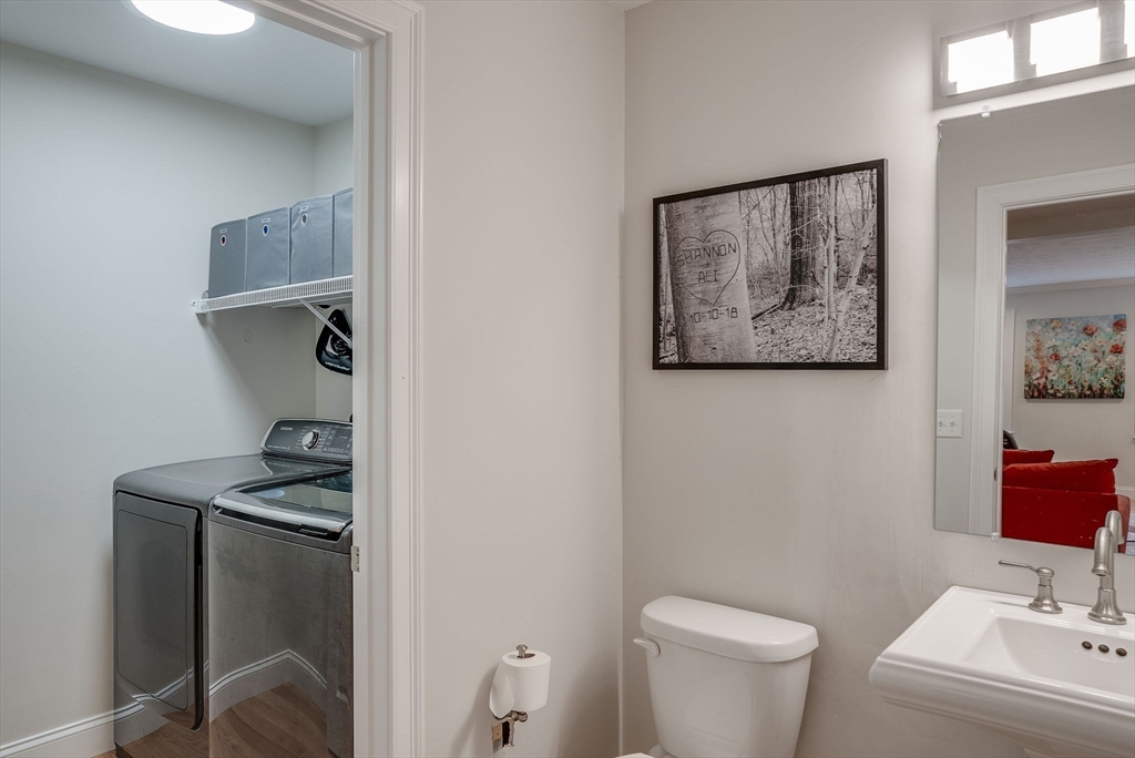 83 Littleton Road Ayer, MA 01432 - Photo 14 of 42 a bathroom with a toilet a sink and mirror