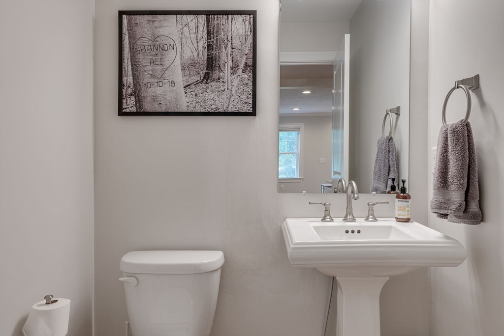 83 Littleton Road Ayer, MA 01432 - Photo 16 of 42 a bathroom with a toilet sink and mirror