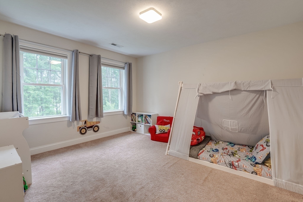 83 Littleton Road Ayer, MA 01432 - Photo 23 of 42 a living room with furniture and a window