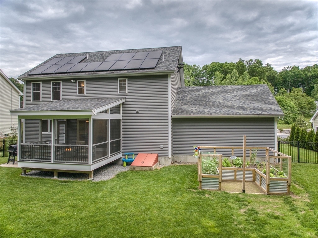 83 Littleton Road Ayer, MA 01432 - Photo 27 of 42 a view of a house with a yard and sitting area