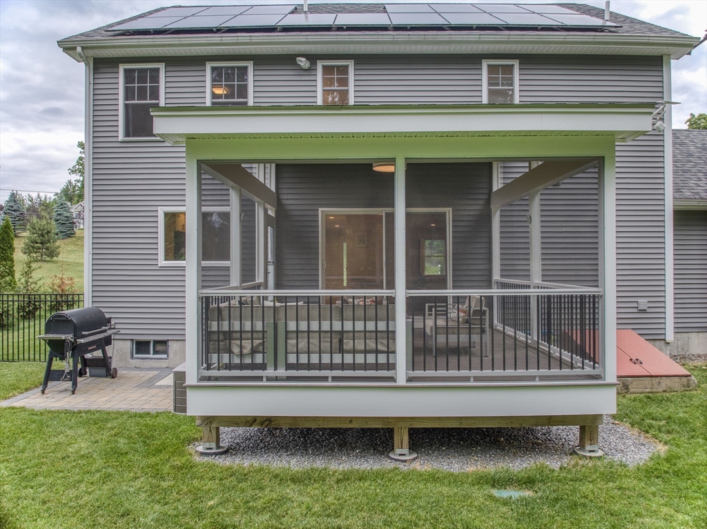 83 Littleton Road Ayer, MA 01432 - Photo 28 of 42 a front view of a house with a garden