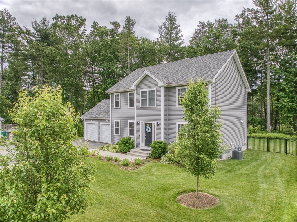 83 Littleton Road Ayer, MA 01432 - Photo 30 of 42 a front view of house with yard and green space