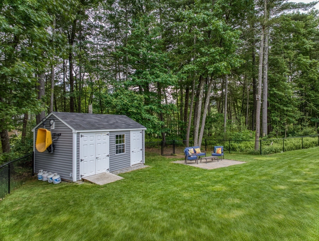 83 Littleton Road Ayer, MA 01432 - Photo 31 of 42 a view of a house with backyard and a tree