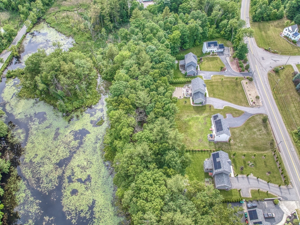 83 Littleton Road Ayer, MA 01432 - Photo 35 of 42 an aerial view of residential house with outdoor space and trees all around
