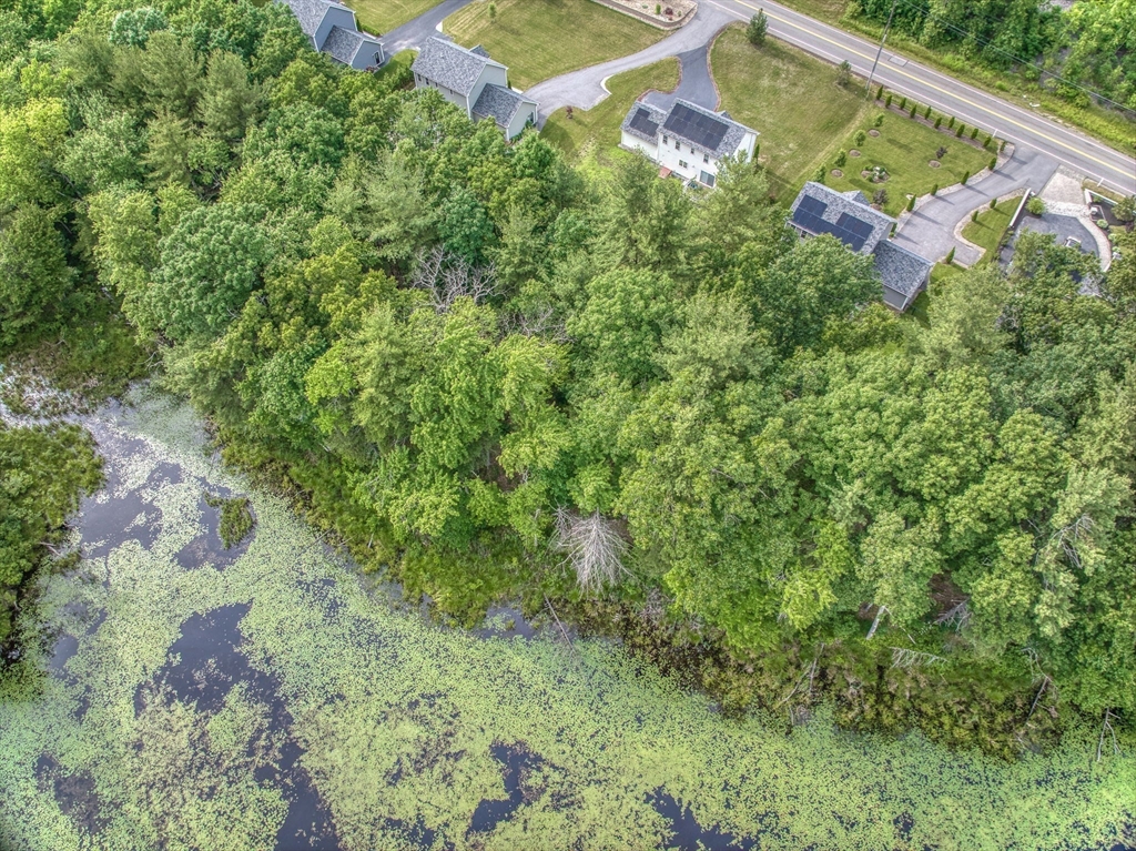 83 Littleton Road Ayer, MA 01432 - Photo 36 of 42 an aerial view of a house with a yard