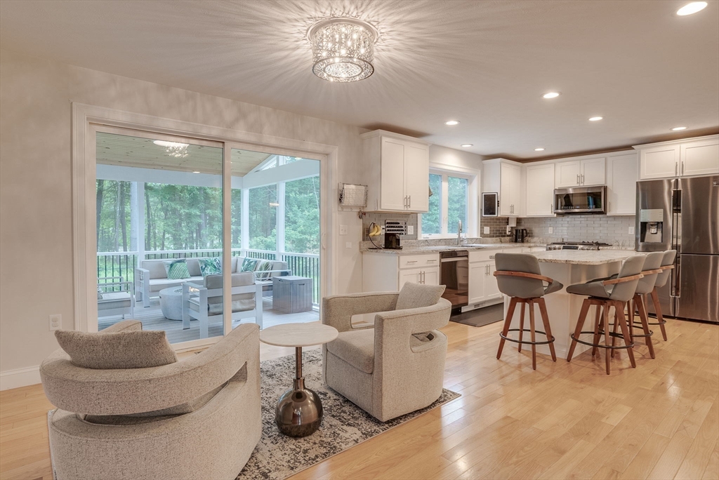 83 Littleton Road Ayer, MA 01432 - Photo 6 of 42 a living room kitchen with stainless steel appliances furniture and a large window