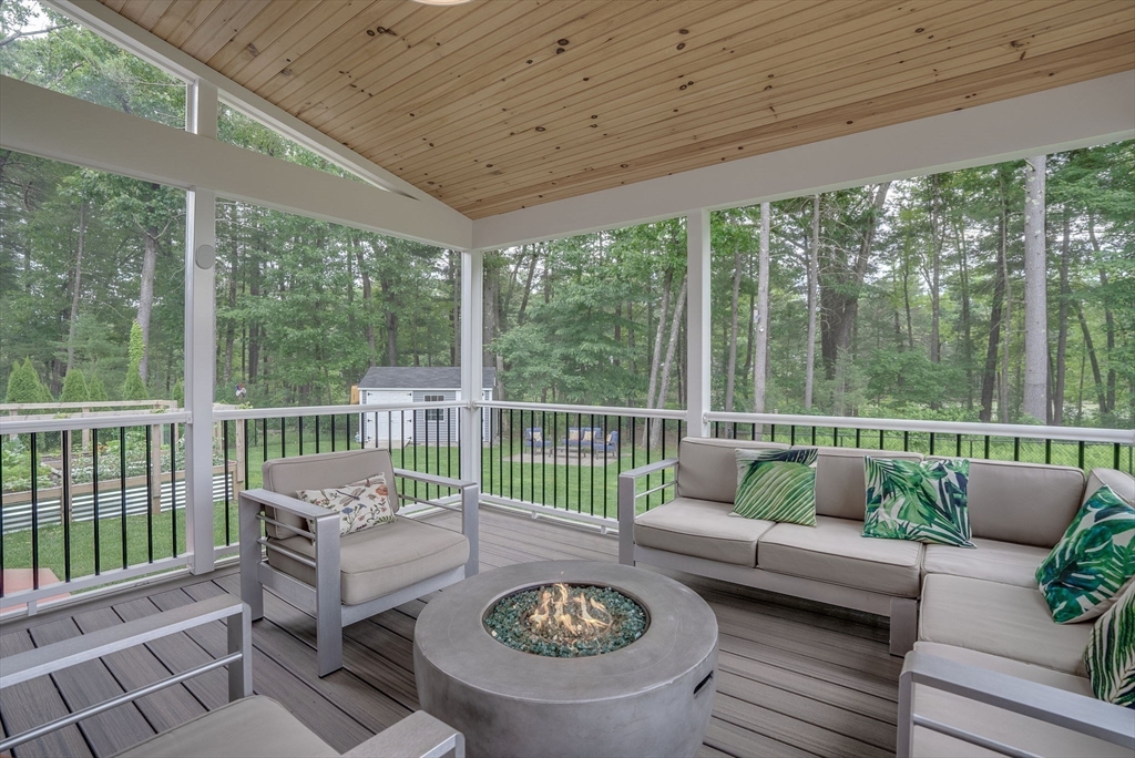 83 Littleton Road Ayer, MA 01432 - Photo 8 of 42 a balcony with furniture and a potted plant