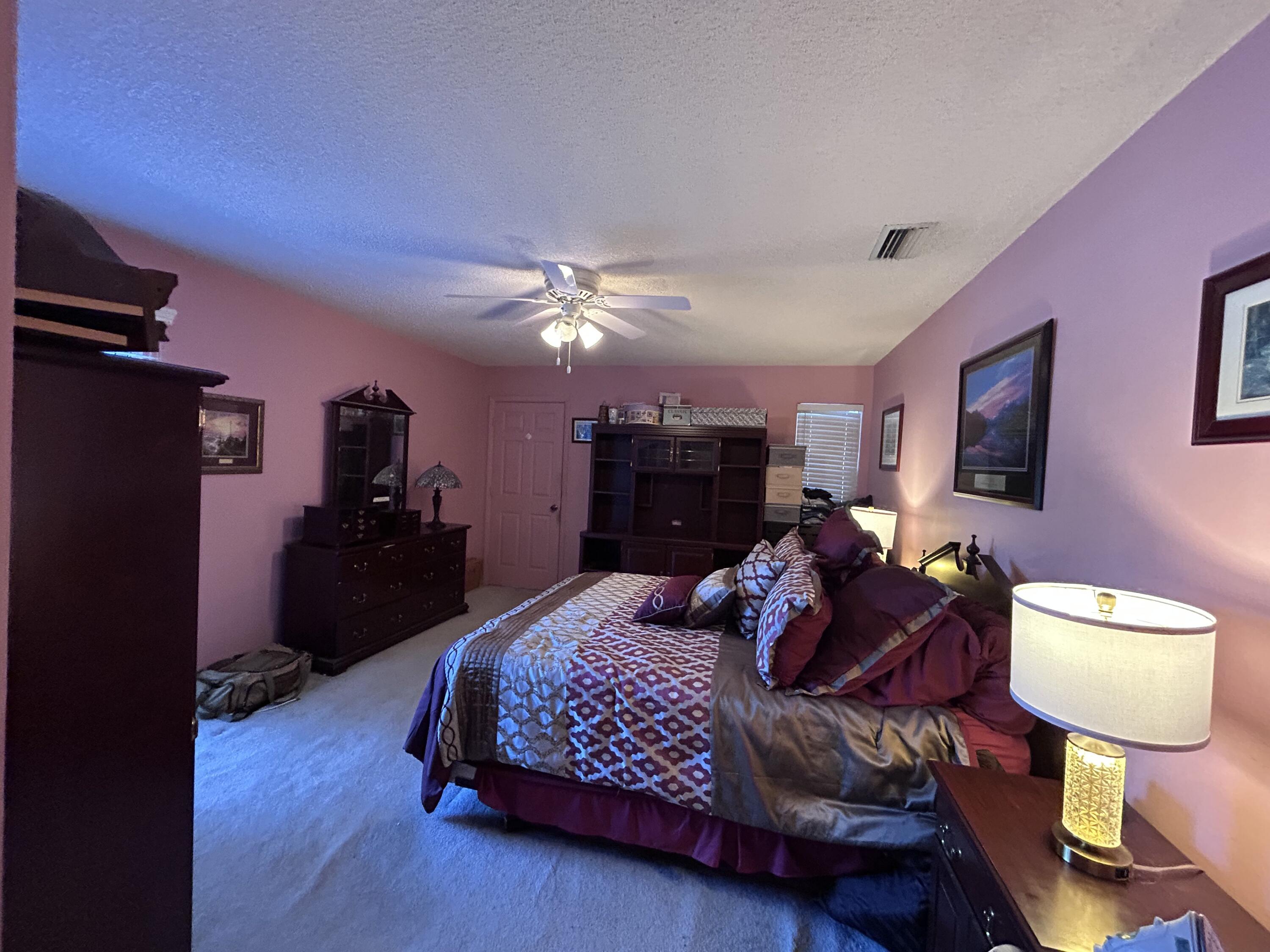 21437 54th Drive South Boca Raton, FL 33431 - Photo 11 of 15 a bedroom with bed and wooden floor