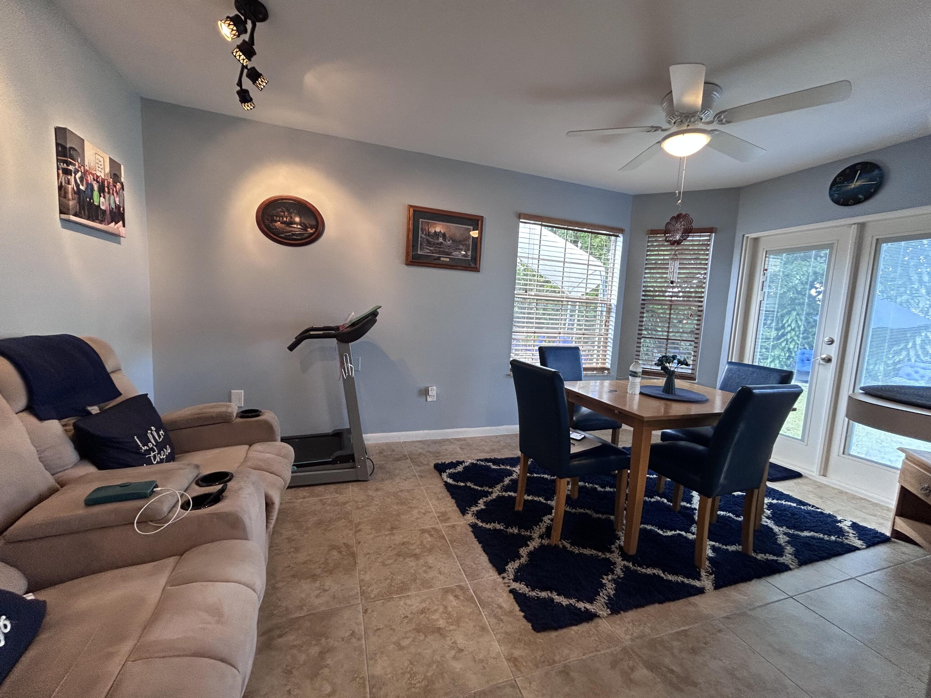 21437 54th Drive South Boca Raton, FL 33431 - Photo 3 of 15 a view of a livingroom with furniture and a dining table