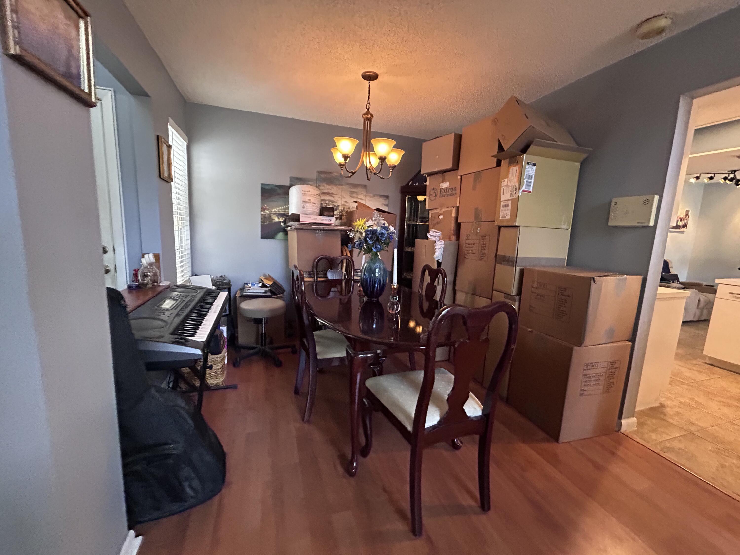 21437 54th Drive South Boca Raton, FL 33431 - Photo 6 of 15 a view of a room with furniture and wooden floor