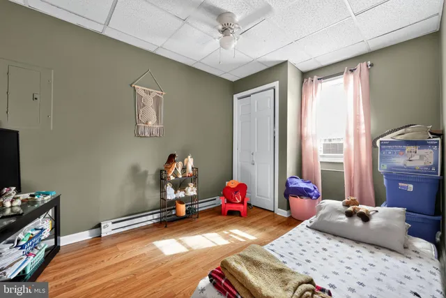 a bedroom with bed and a window