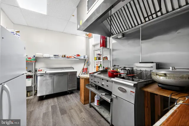 a kitchen with a stove and a microwave