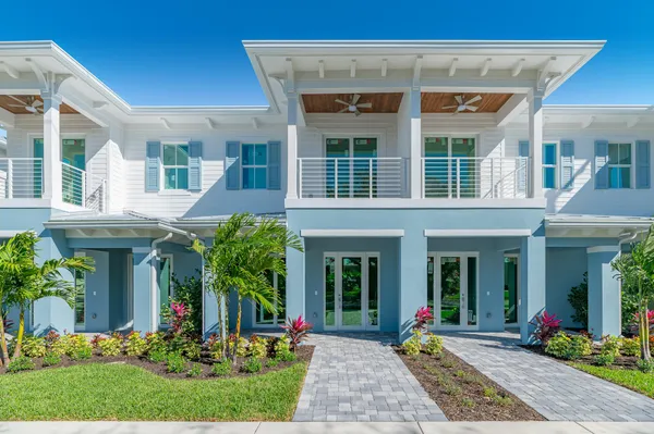 a front view of house with yard and outdoor seating