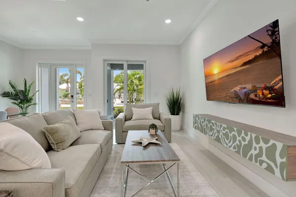 a living room with furniture and a flat screen tv