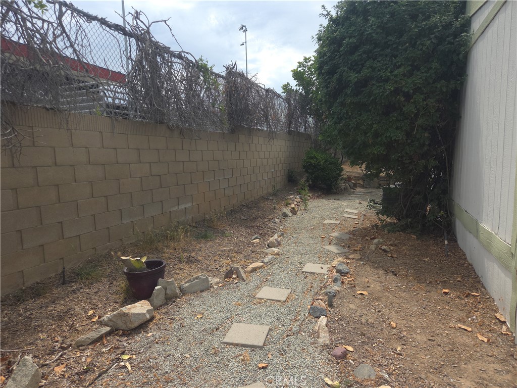 1550 Rimpau Avenue, Unit 20 Corona, CA 92881 - Photo 17 of 42 a view of a backyard of the house