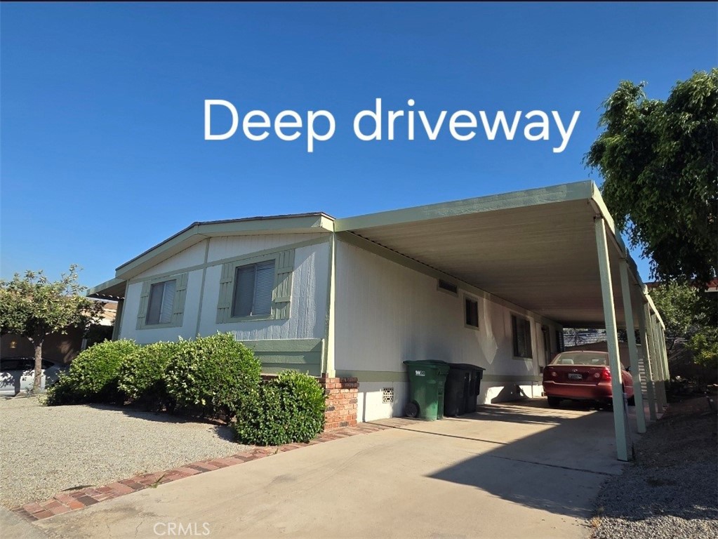 1550 Rimpau Avenue, Unit 20 Corona, CA 92881 - Photo 19 of 42 a view of a house with a street