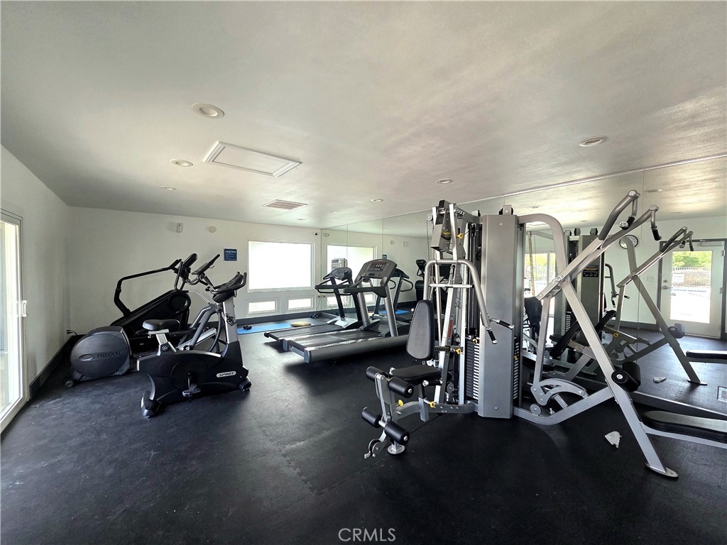 1550 Rimpau Avenue, Unit 20 Corona, CA 92881 - Photo 29 of 42 a view of a room with gym equipment