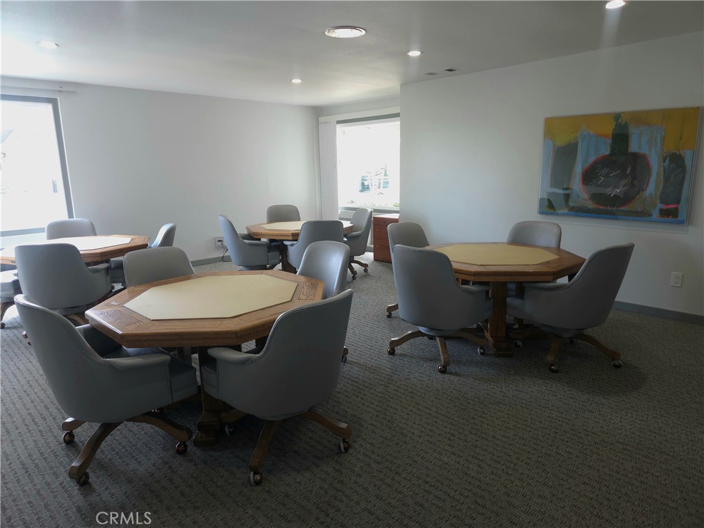 1550 Rimpau Avenue, Unit 20 Corona, CA 92881 - Photo 31 of 42 a view of a dining room with furniture