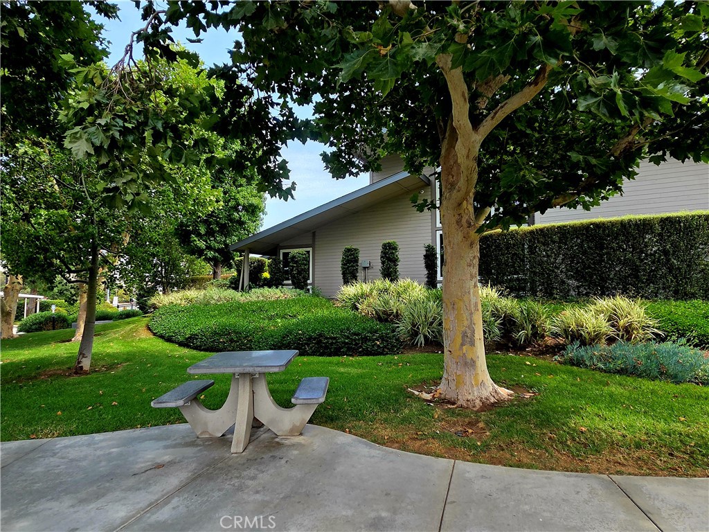 1550 Rimpau Avenue, Unit 20 Corona, CA 92881 - Photo 35 of 42 a view of a house with backyard and garden