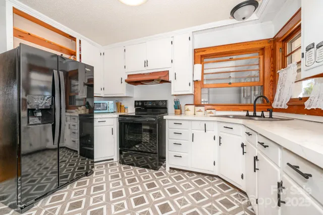 a kitchen with cabinets and appliances