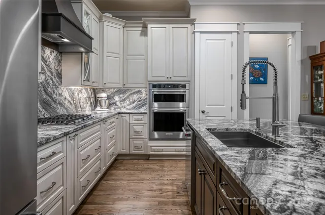 a spacious bedroom with a large bed and a window